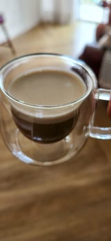 Enjoy the moment with the elegance of this coffee cup in a woman's hands. Warmth and flavor in every detail. Get this irresistible image now photo