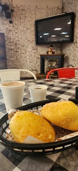 breakfast with cheese bread and a glass of espresso photo