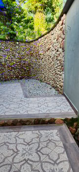 stone wall with colorful Portuguese flooring photo