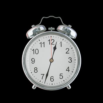 12h 33m AM or PM Vintage Steel Alarm Clock photo