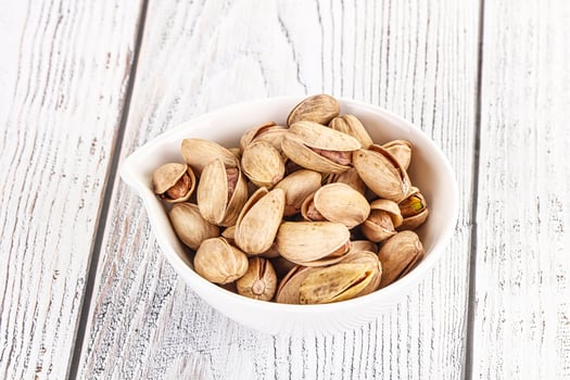 Salted tasty pistachio nuts heap photo
