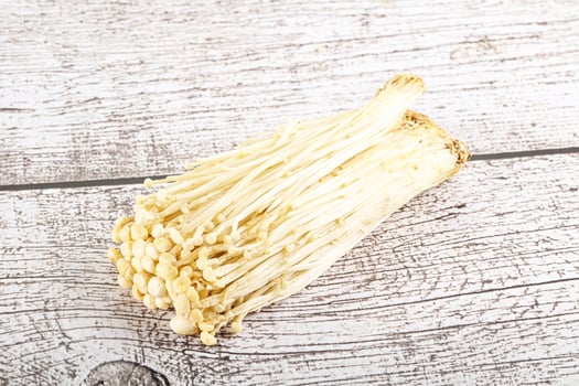 Tasty raw enoki mushroom heap photo