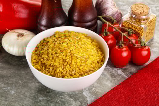 Dry wheat bulgur cereal heap photo