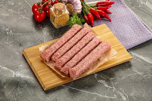 Raw beef kebab sausage for grill photo