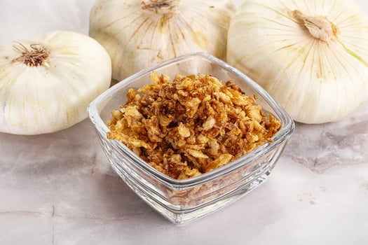 Dried roasted onion flakes for culinary photo