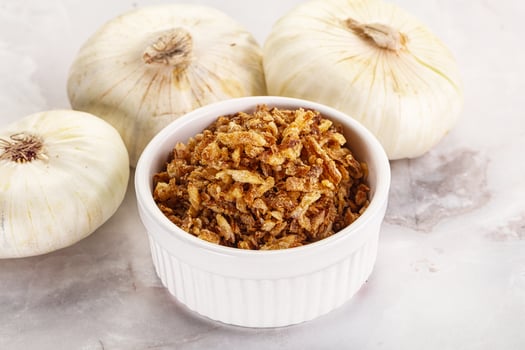 Dried roasted onion flakes for culinary photo