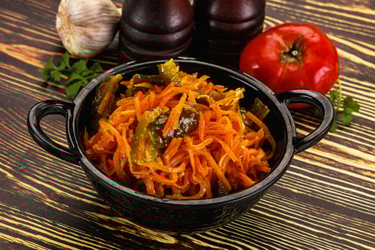 Salad with korean carrot and cucumber photo