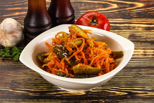 Salad with korean carrot and cucumber photo