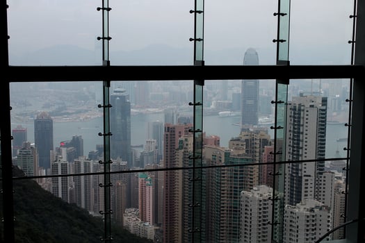 Beautiful cityscape of Hong Kong city through the window at rainy day with foggy background photo