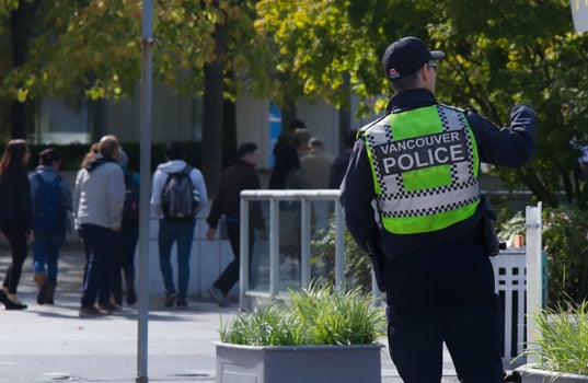 Vancouver, Canada - September 20,2019 Traffic police officer on duty patrols road in Downtown Vancouver, Canada photo