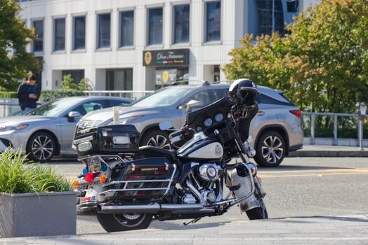 Vancouver, Canada - September 20, 2019 Police motocycle standing on the Side of the West Waterfront road in Vancouver at sunny day photo