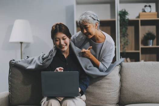 Asian elderly women and friend using social media and living room. streaming, happiness and conversation at a house with old people together photo