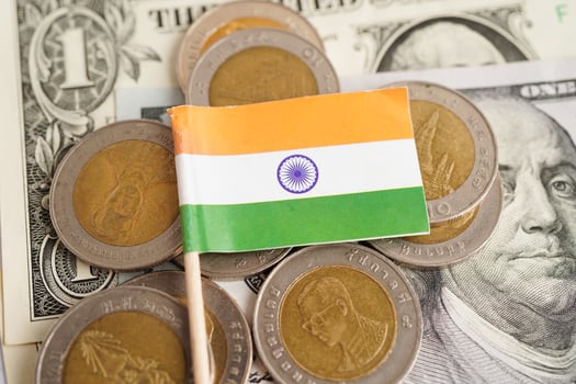 India flag on coins background, finance and accounting, banking concept. photo