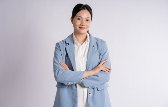 Portrait of young businesswoman posing on white background photo