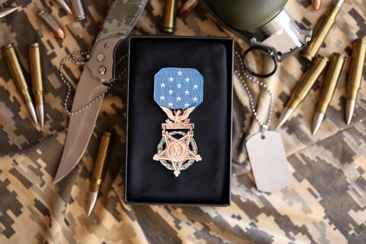 KYIV, UKRAINE - JULY 10, 2024 US Army Medal Of Honor. Highest United States military award medal with ribbon and pin. Handmade paper theater props photo