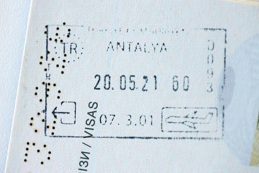 KYIV, UKRAINE - APRIL 20, 2024 Page of foreign passport with visas, Turkiye border stamps, permits to enter countries, concept of traveling around the world, travelers document photo