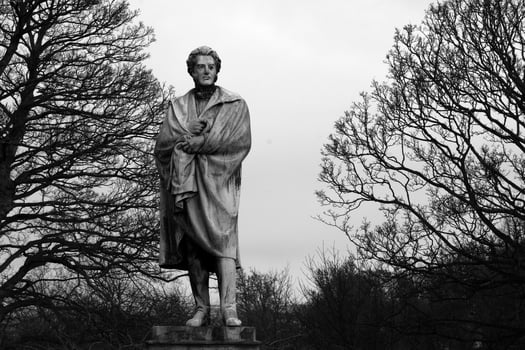 Sculpture close view background. Monument art. Black and white monochrome grayscale photo
