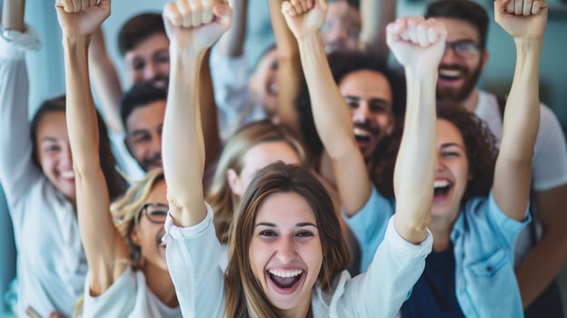 Group of happy young people raising their hands and looking at camera. photo