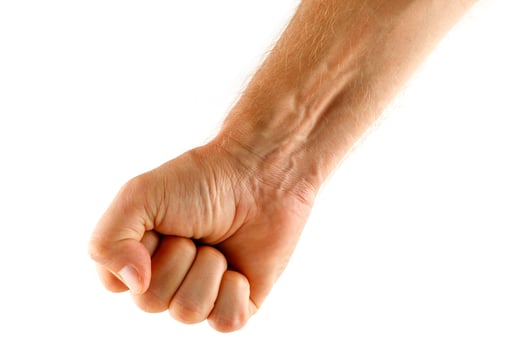 Fist male isolate. Symbol of resistance, strength and aggression. photo