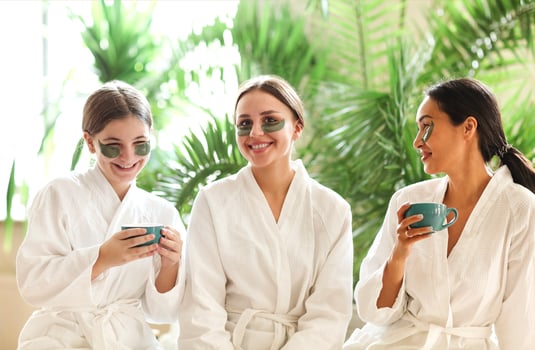 Company of girls in bathrobes and eye patches photo