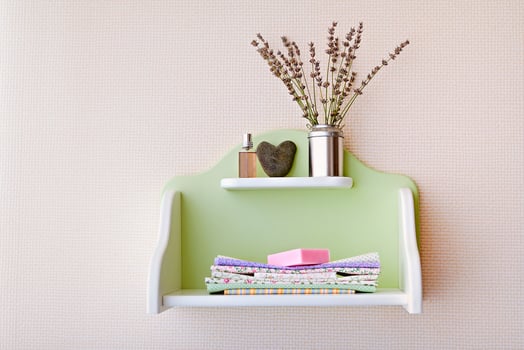 Shelf with flowers, textile and soap photo