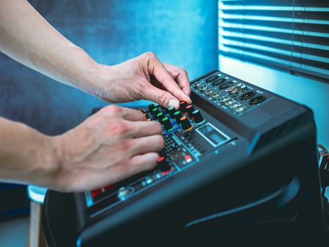 Sound engineer hands adjusting control sound mixer in recording, broadcasting studio,Sound mixer. Professional audio mixing console, buttons, faders and sliders. sound check. photo