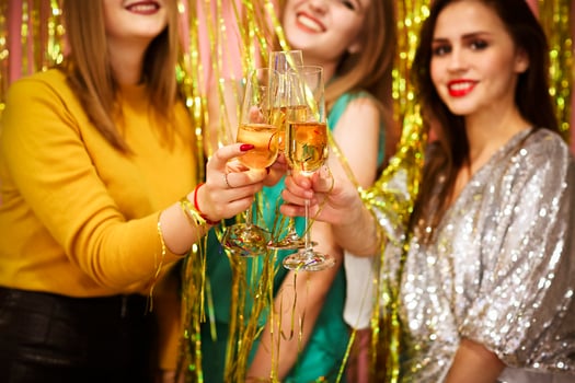 Women proposing toast during party photo