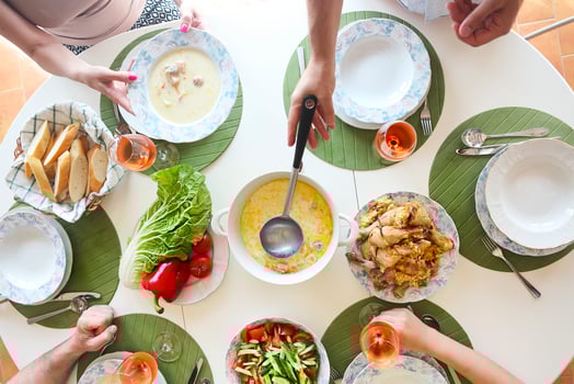 Close up of the table fish soup, salad and chicken photo