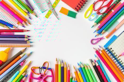 A clean white background with colorful school supplies around the edges. photo