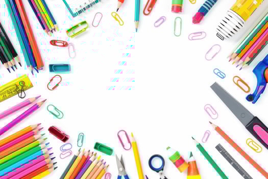 A clean white background with colorful school supplies around the edges. photo