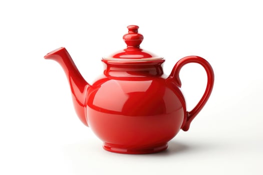 A red ceramic teapot isolated on a white background. photo