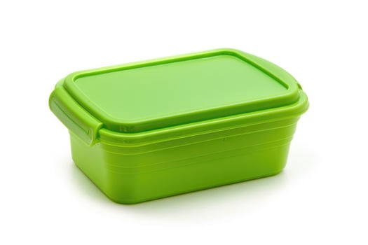 A green plastic lunch box isolated on a white background. photo