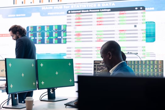 Project manager works with infographics reports and green screen, ensuring business objectives achievement. Male analyst studying the current financial progress, data management. photo