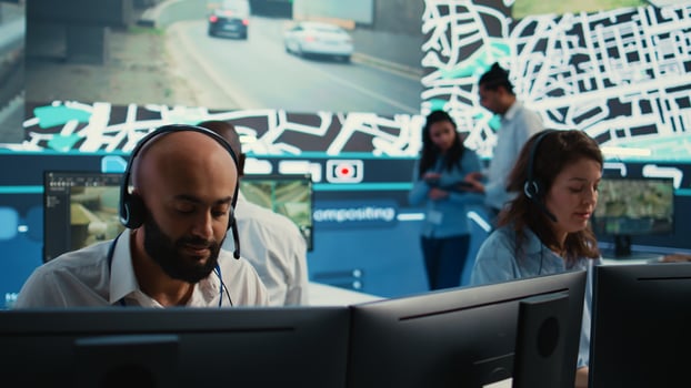Woman call center operator transmitting directions through traffic after monitoring surveillance radar system at stop lights. Employee working on order tracking and express delivery. Camera B. photo