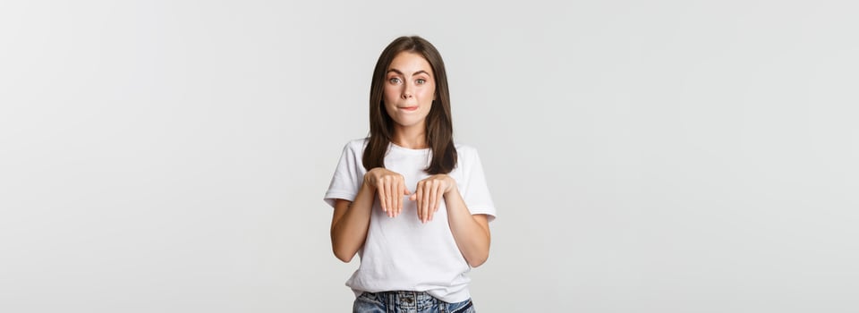Silly and cute brunette girl smiling and standing in puppy pose photo