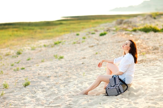 Calm woman on hill during sunset photo