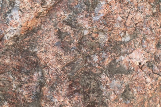 Abstract natural rock stone granite grunge rusty metal texture design background natural color stone material granite design wallpaper. Close-up detail of natural stone photo