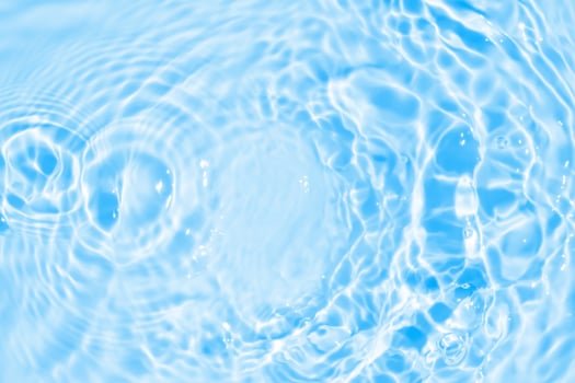 Abstract transparent water shadow surface texture natural ripple on blue background photo
