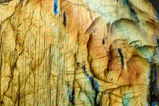 macro mineral stone labradorite on a black background photo
