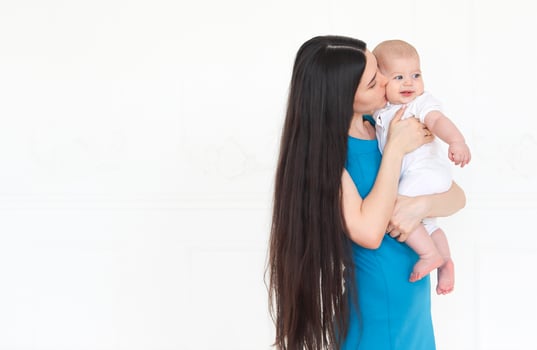 Mother holding sweet baby boy photo