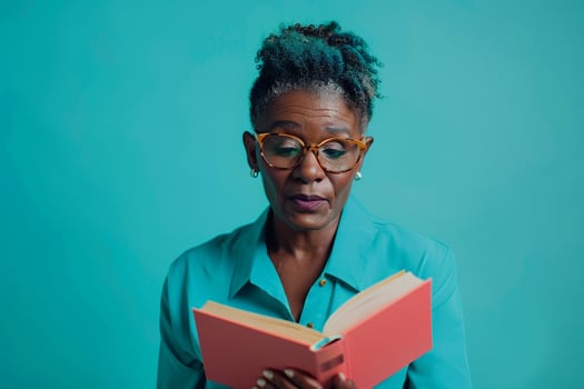 Portrait of Teacher with Book on  Teal Background photo