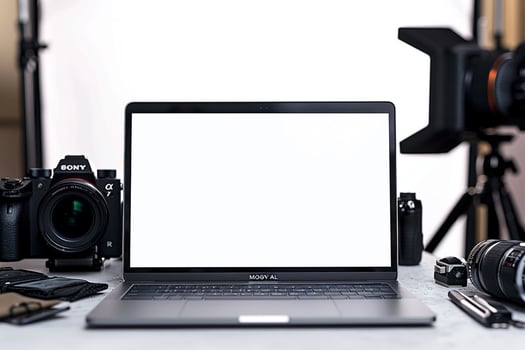 Laptop Mockup Background Surrounded by Camera Gear photo
