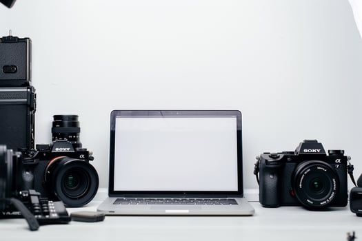 Laptop Mockup Background Surrounded by Camera Gear photo