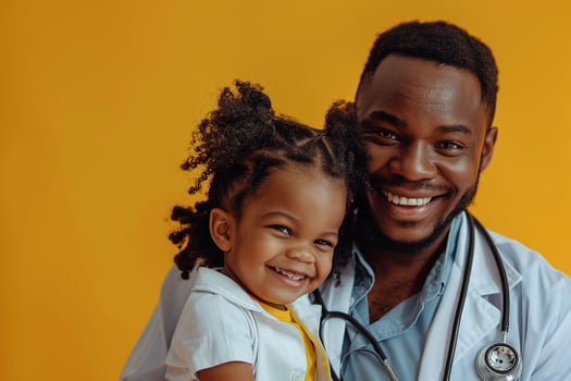Pediatrician with Stethoscope and Smiling Child photo