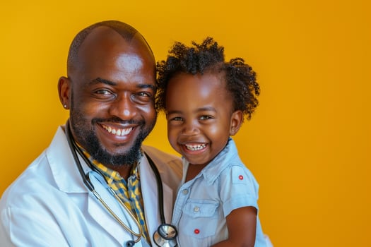 Pediatrician with Stethoscope and Smiling Child photo