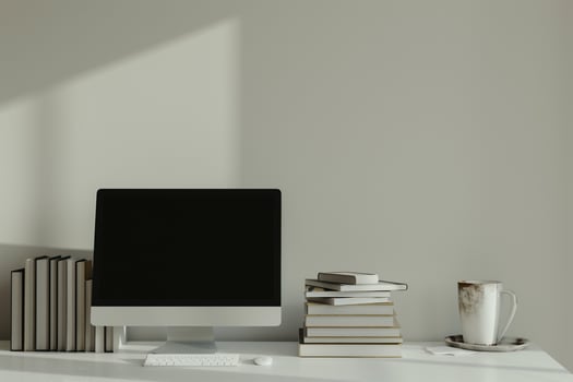 Computer Mockup Background with Stacked Books on White Desk Study Area photo