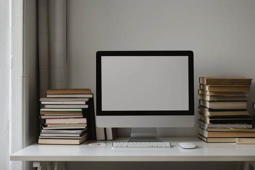 Computer Mockup on White Desk with Stacked Books ed Study Area Background photo