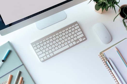 Computer Mockup on White Desk with Notebooks and Pens for Productive Writing and Editing photo