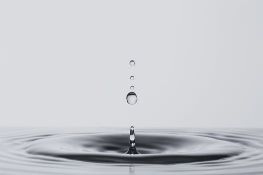Single Water Droplet Impacting the Surface of a Pool with High Speed Precision photo
