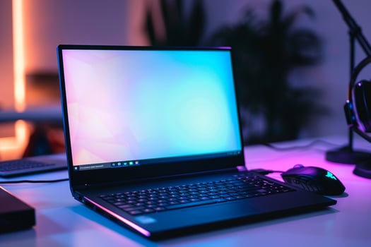 Laptop Mockup on a White Desk with Gaming Mouse for a Cutting Edge Gaming Setup photo